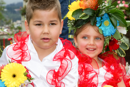 FUNCHAL, MADEIRA - APRIL 20, 2015: Children in floral costumes at the Flower Festival Parade, Funchal, Madeira, Portugalのeditorial素材