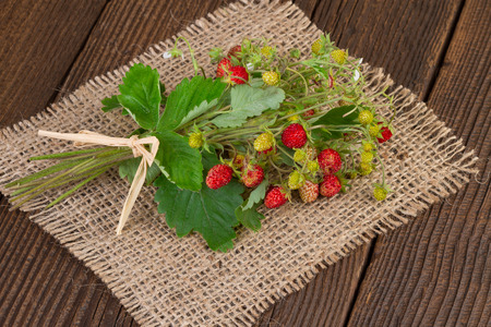 wild strawberries on a jute background