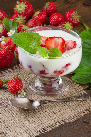 Strawberries Dessert in a glass with vintage spoonの写真素材