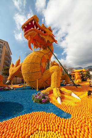 MENTON, FRANCE - FEBRUARY 20: Dragon statue on Lemon Festival (Fete du Citron) on the French Riviera.The theme for 2015 was "Tribulations of a lemon in China". Menton, France - Feb 20, 2015のeditorial素材