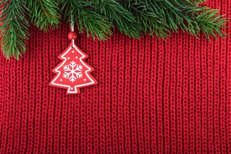 Christmas Decoration on Red Knitted Background