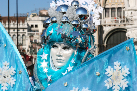 Costumed person posing at Venice Carnival, S. Marco square, Venice.の写真素材