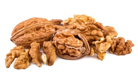 Walnuts and shelled walnuts on white background. Closeup.の写真素材