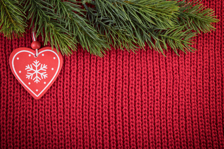 Christmas red wool background with traditional tree decoration in a farmhouse styleの写真素材