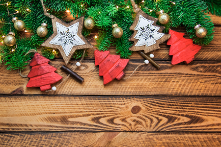 Christmas red gold vintage decoration with green fir branch over dark wooden background. Flat lay, text spaceの写真素材