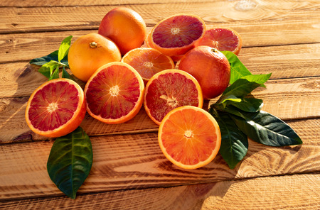 Orangen fruit or blood oranges organic fruits in close-up. Outdoor shot in the sunshineの写真素材