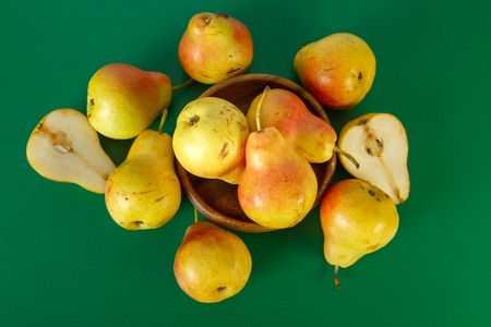 Pears on green background, top viewの写真素材