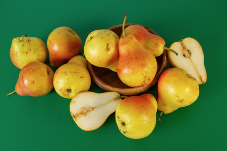 Bright Red Yellow Pears On Green Backgroundの写真素材