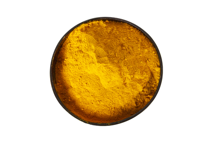 Turmeric powder in wooden bowl isolated on white. Top view overhead shotの写真素材