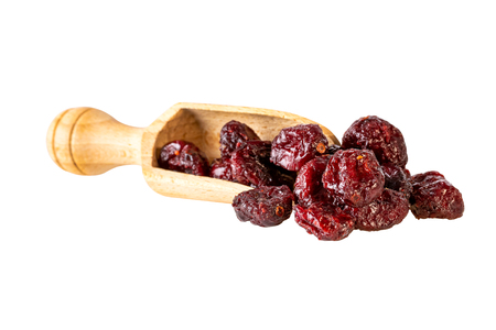 dried cranberries in scoop isolated on white. Image included clipping pathの写真素材