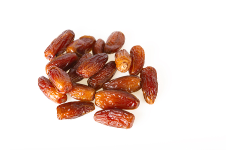 dates fruits dried sweet isolated on white overhead shotの写真素材