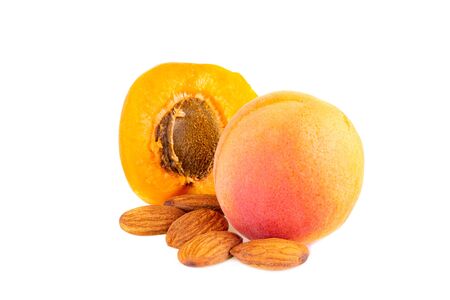 Apricot in close up. Apricots with fruit kernels isolated on white background.の写真素材