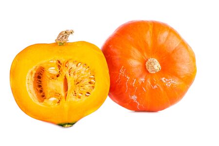 Hokkaido pumpkin two pumpkins whole and halved isolated on whiteの写真素材