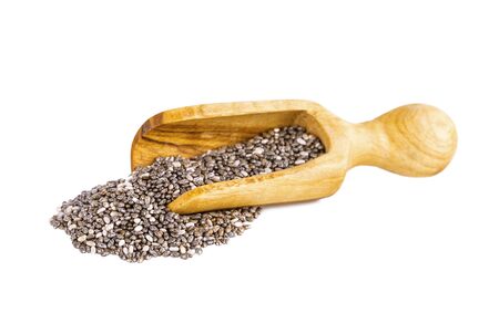 chia seeds in wooden scoop isolated on whiteの写真素材