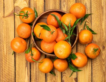 tangerine fruits over old wooden background, top view, overheadの写真素材