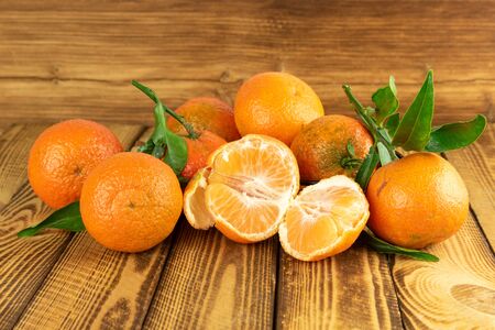 organic mandarin fruits on old wooden backgroundの写真素材