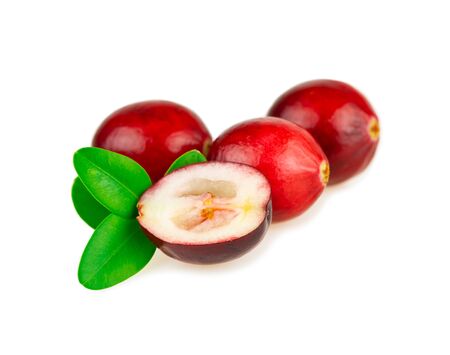 Cranberries red acid berry with green leaves on white backgroundの写真素材