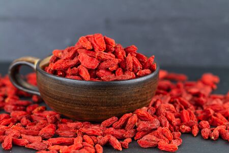 Dried goji berries on grey slateの写真素材