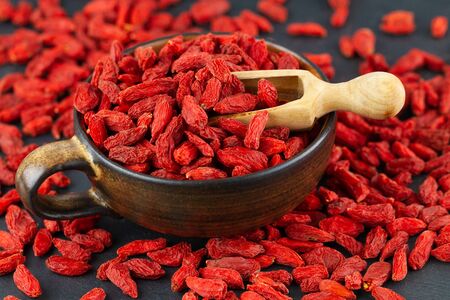 Cup with goji berries in close up.の写真素材