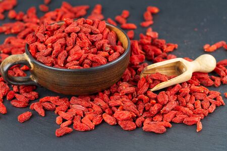 Dried goji berries on grey slate plateの写真素材