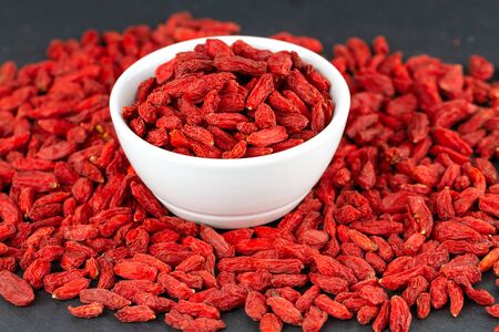 Closeup of goji berry in a white cup. Selective focusの写真素材