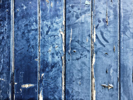 Blue wooden background with peeling paint and vintage effect and space for text.の写真素材