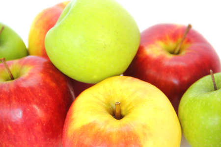 Juicy, multi-colored apples on a white background の写真素材