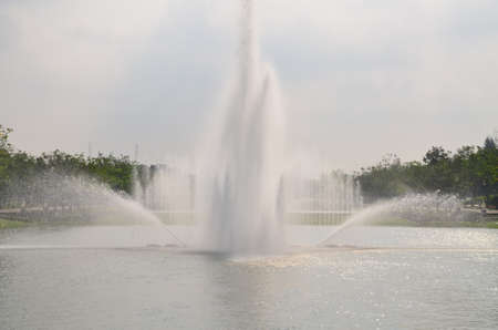 The fountain on the pool in the gardenの写真素材