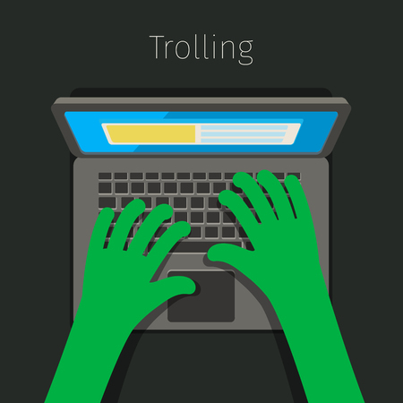 Concept of trolling in internet. Internet troll using a laptop. Flat design, vector illustration.のイラスト素材