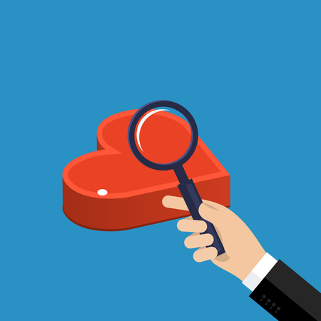 Concept of love or relationship. Hand with magnifying glass looks at heart.のイラスト素材