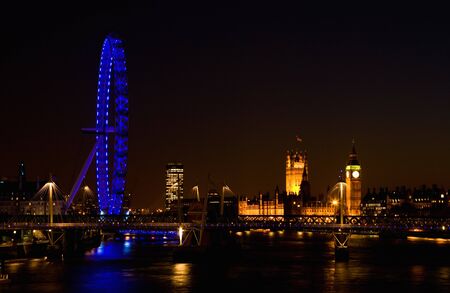 London, UK - March 7, 2011: London Eye and Westminster in the distance seen from Waterloo Bridge at dusk. のeditorial素材