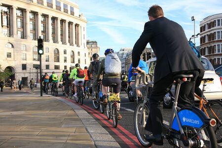 London, UK - October 2, 2010 - Bicycle commuters on their way to work after crossing Blackfriars bridge in early morning. のeditorial素材