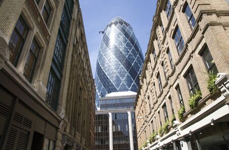 London, UK - May 25, 2011: Outsid view of 30 St Mary Axe, likely being called Gherkin, 30 St Mary Axe was completed in December 2003 and now this is one of the most iconic modern buildings in London. のeditorial素材