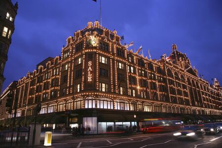 London, UK - January 15, 2011 : Night View of Harrods department store in the Brompton Road, near Knightsbridge Tube Station. This department store was opened at 1824 and now it is one of the most famous luxury store in London. のeditorial素材