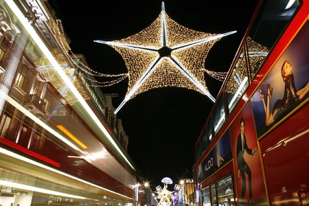London, UK - November 17, 2011: Christmas Lights Display on Oxford Street in London. The modern colourful Christmas lights attract and encourage people to the street. のeditorial素材