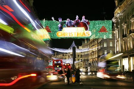 London, UK - November 17, 2011: Christmas Lights Display on Regend Street in London. The modern colourful Christmas lights attract and encourage people to the street.のeditorial素材