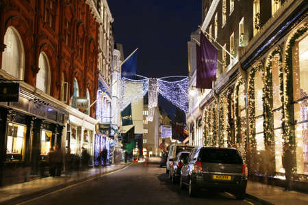 London, UK - November 18, 2011: Christmas Lights Display on Bond Street in London. The modern colourful Christmas lights attract and encourage people to the street. のeditorial素材
