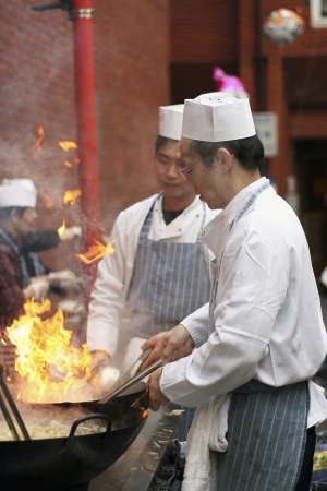 London, UK - February 18, 2007: Chinese chefs work at the Chinese New Year celebrations in London's Chinatown. のeditorial素材