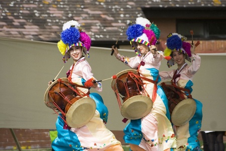 London, UK - August 15, 2009: Korean ethnic dancers perform, Jangguchum, dance with janggu, hourglass-shaped drum, in the Korean Festival on August 15, 2009 in London, UK. 
のeditorial素材