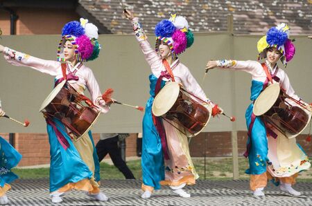 London, UK - August 15, 2009: Korean ethnic dancers perform, Jangguchum, dance with janggu, hourglass-shaped drum, in the Korean Festival on August 15, 2009 in London, UK. 
のeditorial素材
