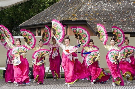 London, UK - August 15, 2009: Korean ethnic dancers perform, Buchaechum, fan dance, in the Korean...