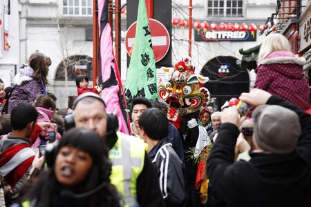 LONDON - January 29, 2012: Performers, lion dance, take part in the celebration of Chinese New Year. Various traditional performance attract thousands of people to the street. 
のeditorial素材