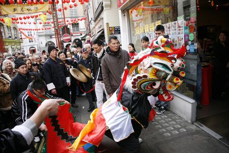LONDON - January 29, 2012: Performers, lion dance, take part in the celebration of Chinese New Year. Various traditional performance attract thousands of people to the street. 
のeditorial素材