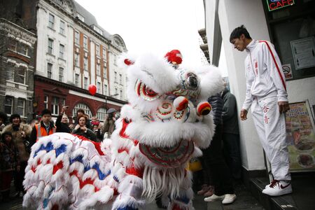 LONDON - January 29, 2012: Performers, lion dance, take part in the celebration of Chinese New Year. Various traditional performance attract thousands of people to the street. 
のeditorial素材