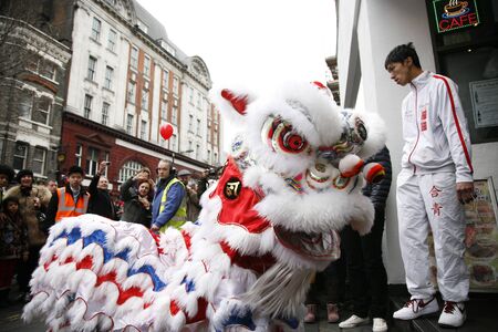 LONDON - January 29, 2012: Performers, lion dance, take part in the celebration of Chinese New Year. Various traditional performance attract thousands of people to the street. 
のeditorial素材