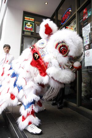 LONDON - January 29, 2012: Performers, lion dance, take part in the celebration of Chinese New Year. Various traditional performance attract thousands of people to the street. のeditorial素材