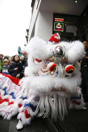 LONDON - January 29, 2012: Performers, lion dance, take part in the celebration of Chinese New Year. Various traditional performance attract thousands of people to the street. のeditorial素材