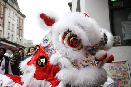 LONDON - January 29, 2012: Performers, lion dance, take part in the celebration of Chinese New Year. Various traditional performance attract thousands of people to the street. のeditorial素材