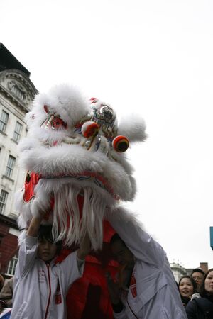LONDON - January 29, 2012: Performers, lion dance, take part in the celebration of Chinese New Year. Various traditional performance attract thousands of people to the street. のeditorial素材
