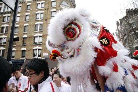 LONDON - January 29, 2012: Performers, lion dance, take part in the celebration of Chinese New Year. Various traditional performance attract thousands of people to the street. のeditorial素材